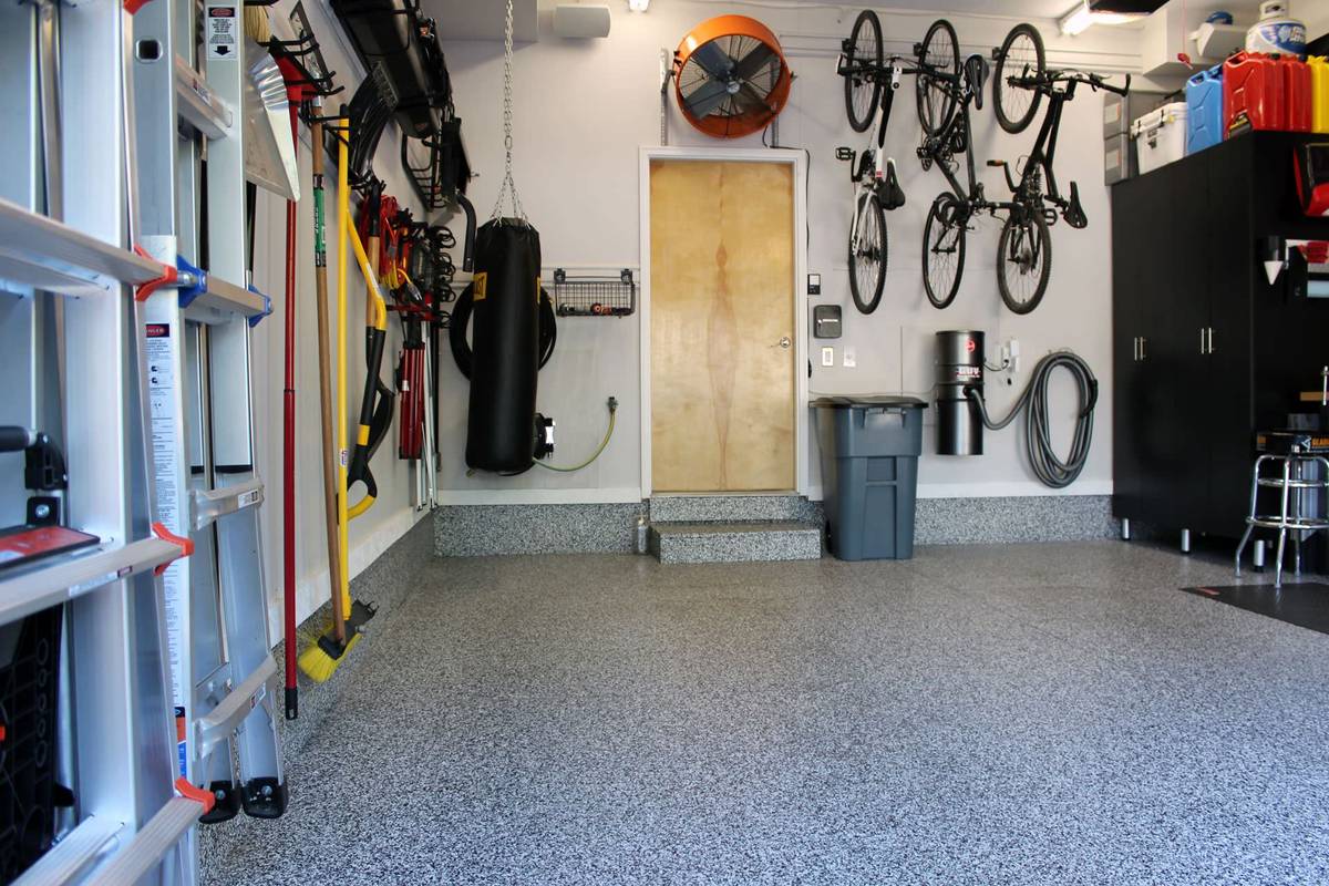 Flake epoxy garage floor with storage in the Denver metro